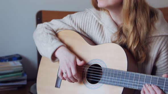 Closeup Of Woman Singing With Guitar