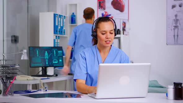 Medical Assistant Operator with Headphone Consulting Patients
