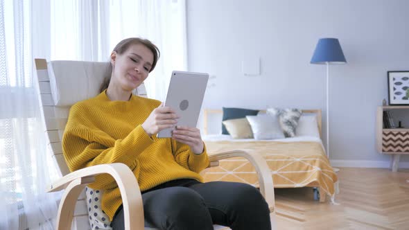 Online Video Chat on Tablet by Middle Aged Woman