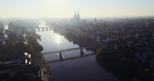 Drone shot of Regensburg and the old town in golden October during sunrise