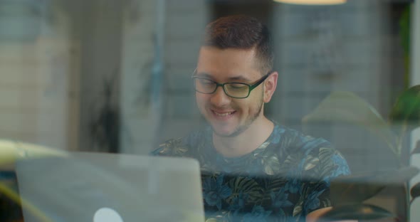 Man Freelancer Using Laptop Online Working in Internet, Guy Typing on Computer Surfing Web Looking