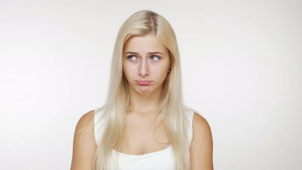 Caucasian Attractive Blondie Girl Looking at Camera Pretending to Be Hurt Pouting Nodding Positively
