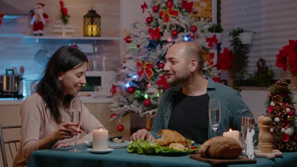 Couple Celebrating Christmas Eve with Presents