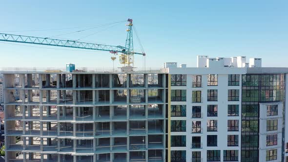 Many windows on new apartment building facade under construction. Real estate development