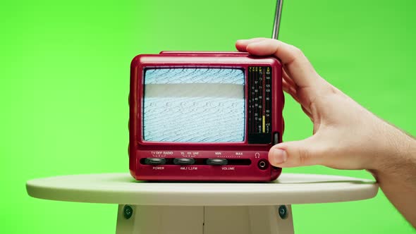 Small Old Television with Grey Interference Screen on Chroma Green Background