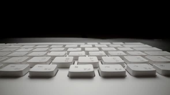 Close-up view of computer keyboard. Macro soft focus dolly shot