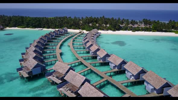 Aerial top down tourism of beautiful coastline beach trip by transparent lagoon and white sand backg