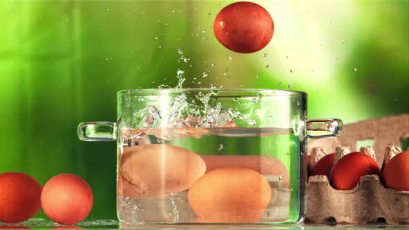 Eggs with Splashes Fall Into a Pot of Water