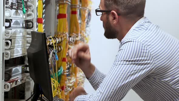 Engineer Working in Data Room