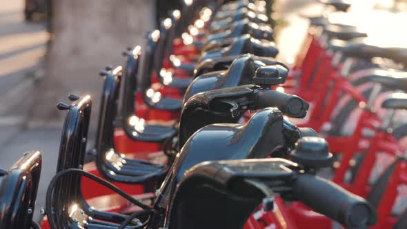 BARCELONA, SPAIN - 25 JANUARY 2019: Row of Red Bicycles in a Bike Rack, Available for Rental on the