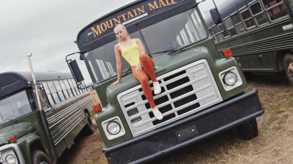 Cool Girl In Yellow Sitting On Old Bus