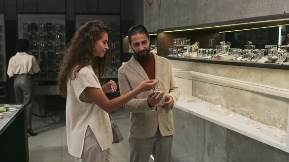 Man and Woman Choosing Jewelry