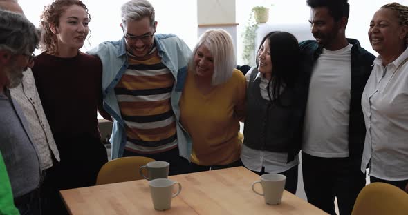 Happy multiracial friends having fun together at home kitchen