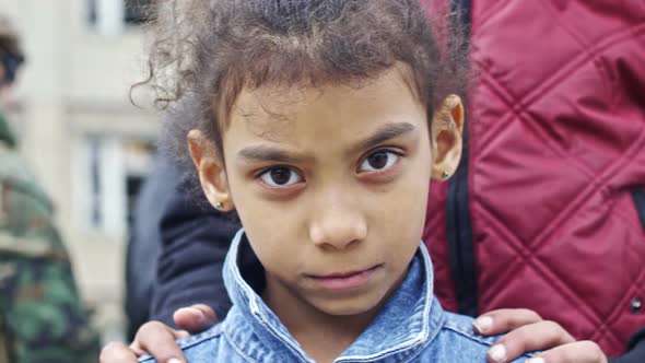 Little Refugee Girl Looking into Camera