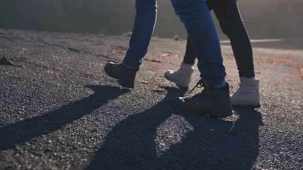 Close Up Shot of Young Loving Couple Walking on Beach in Iceland During Sunset Slow Motion