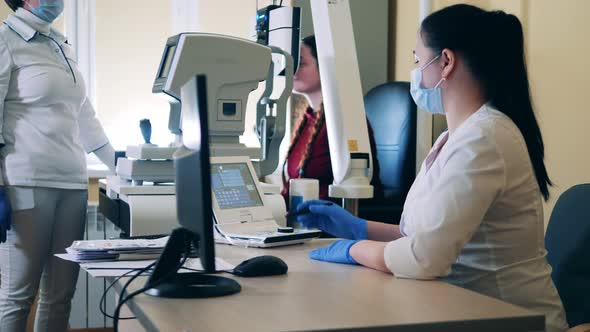 Eyesinspecting Complex is Getting Operated By a Medical Worker / Videohive