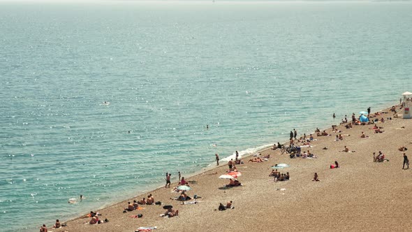 Sand beach with people enjoying summer.