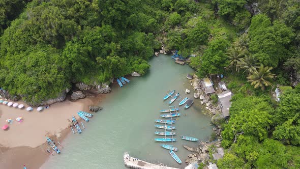 Aerial view of traditional boats in lagoon beach in Indonesia