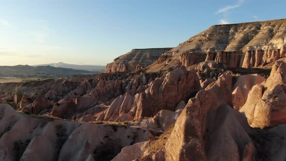 Aerial view of Red Valley and Rose Valley at sunset in Cappadocia, Turkey