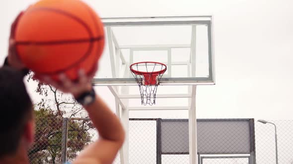 Throw in a Basketball Hoop the Ball Hits the Ring and Flying Through the Net