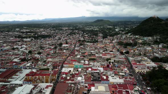 Lateral view of churches and volcanoes in Mexico