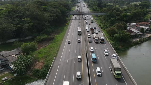 Aerial time lapse view of Indonesia Highway with busy traffic. Karawang, Indonesia.