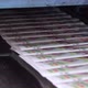 Printed Paper Newspapers are Moved Along Conveyor - VideoHive Item for Sale
