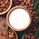 Close Up of Almonds in Wooden Bowl and Almond Milk - VideoHive Item for Sale
