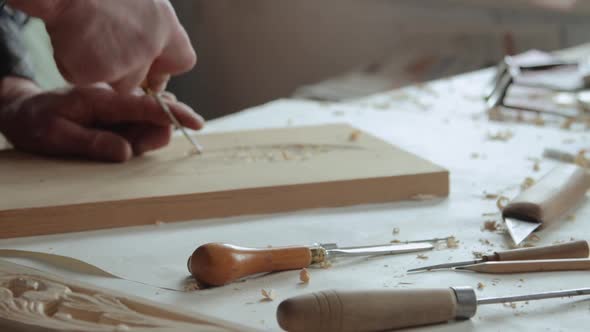 Closeup shoot of a woodcarver at work