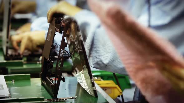 Workers in the Production Line of a Laptop Factory. Fast Motion. 4K Version.