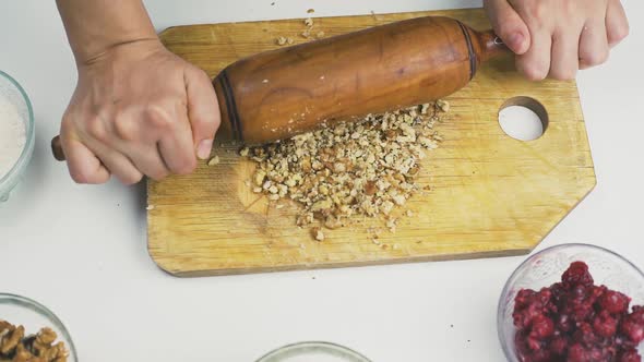 Woman Rolling Out Walnuts