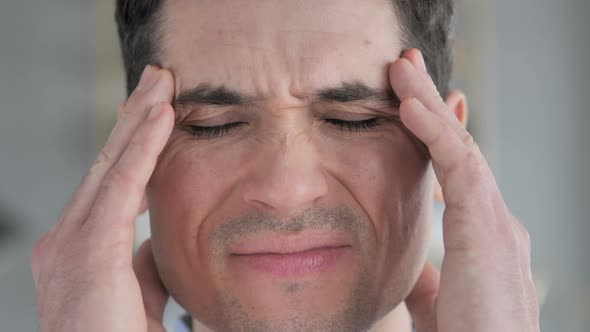 Face Close Up of Young Man with Headache