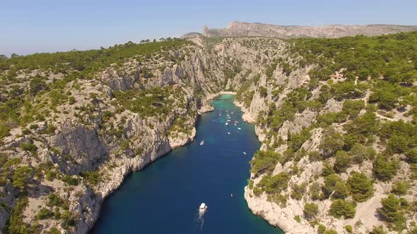 Aerial travel drone view of clear green water, cliffs of Cassis, Mediterranean Sea, Southern France.