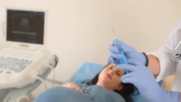 Close Up of Female Doctor in White Lab Coat and Rubber Gloves Holding Sterile