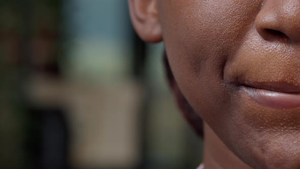 Macro Shot of African American Woman Moving Her Lips