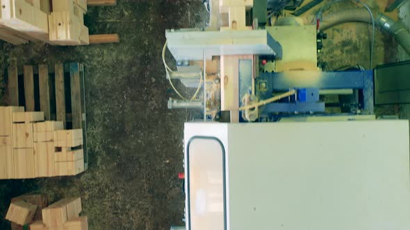 Top View of Wood Going Through the Factory Machine