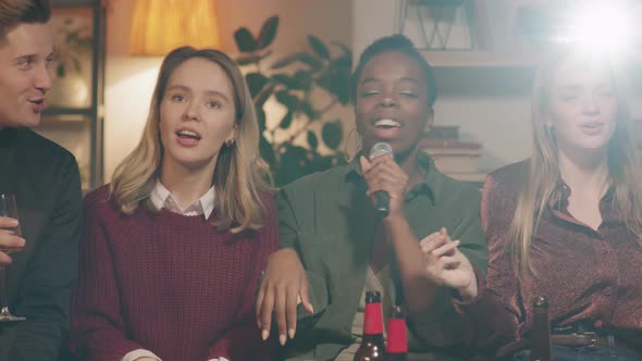 Young People Singing Karaoke at Home