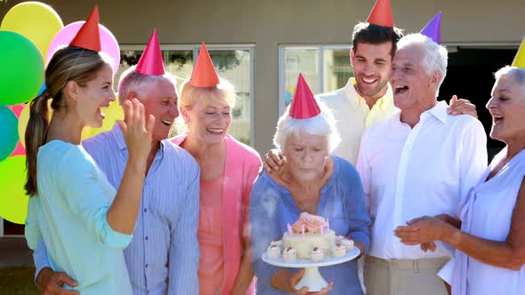 Doctors and senior citizen celebrating birthday