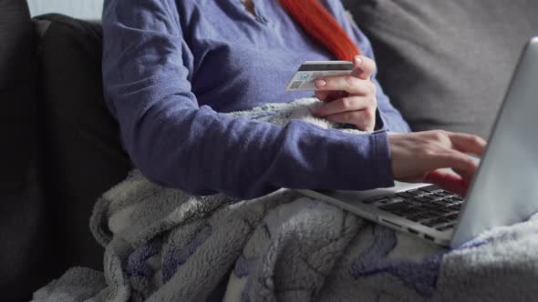 A Woman Makes Online Purchases in Quarantine at Home.