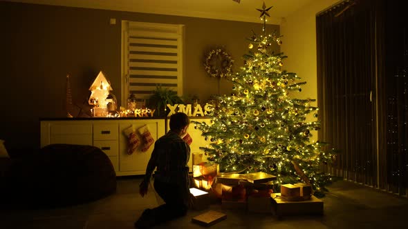 Children at Home on Christmas Eve With Presents