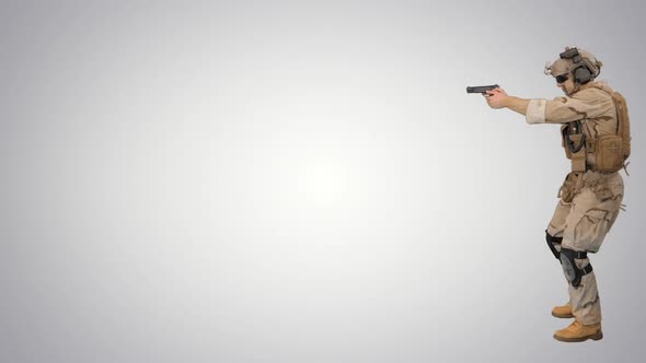 Soldier Walking and Aiming with a Pistol on Gradient Background.