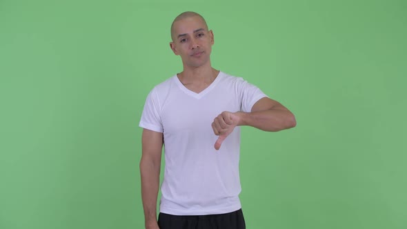 Sad Bald Man Giving Thumbs Down
