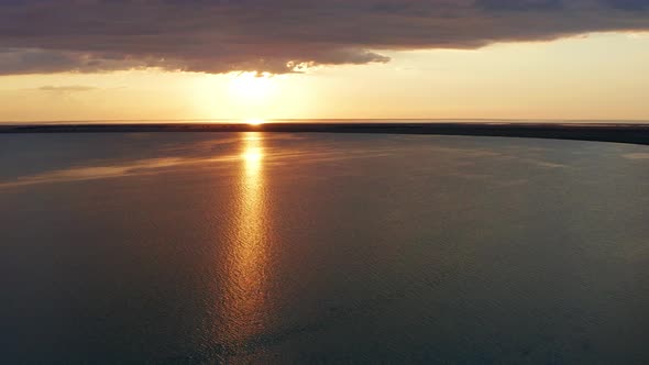 Beautiful sea sunset. Quadcopter flight over the sea at sunset.