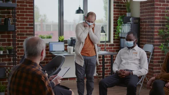 Angry Man Sharing Mental Health Issues with Group of People and Counselor at Aa Meeting