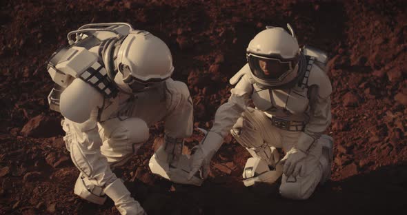 Astronauts Collecting Rock Samples on Mars alt