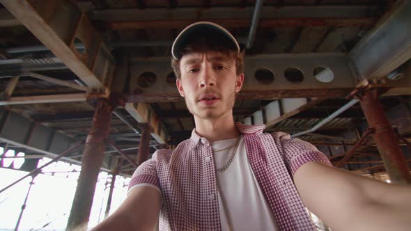 POV Man Watchiing Sport On His Smart Phone Under Pier and Celebrating When He Wins