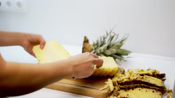 Pineapple cut with knife. Close up view of cut the pineapple with knife