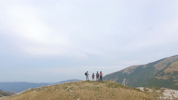 Group of four friends hiking in Umbria, Italy