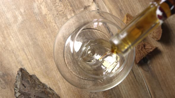 Pouring Cognac Into a Glass