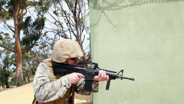 Military soldier during training exercise with weapon